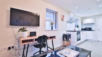 Comfort Apartment, 2 Bedrooms, City View | Living area | 42-inch Smart TV with digital channels