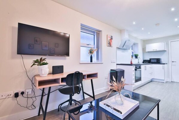 Comfort Apartment, 2 Bedrooms, City View | Living area | 42-inch Smart TV with digital channels