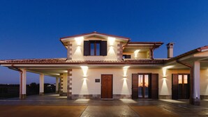 A two-story house with a covered driveway and a large front door. - Villa Olivieri B&B - Wellness House  (Viterbo)