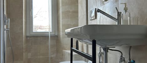 Shower, hair dryer, towels, soap