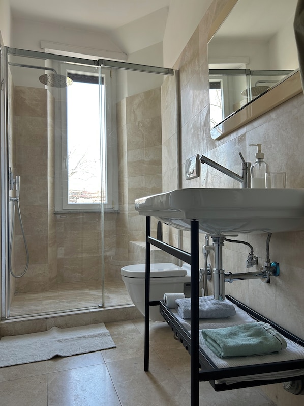 Shower, hair dryer, towels, soap