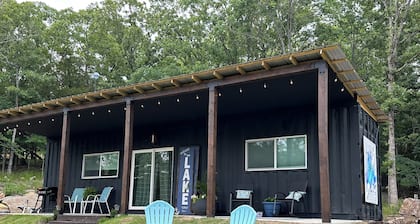 Charming shipping container home with lake view and boat ramp.