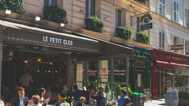 A street scene with outdoor seating at a café named 'Le Petit Cler.' - The Sparkle - Tour Eifflel view by Mon Petit Faré (Paris)