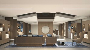 A modern hotel lobby with a central seating area, wooden paneling, and a large circular mirror on the wall. - Fairfield By Marriott Suzhou Jinji Lake (Suzhou)