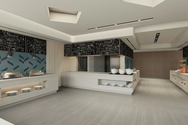 Una cocina moderna con electrodomésticos integrados, una isla central y una pared de pizarra.