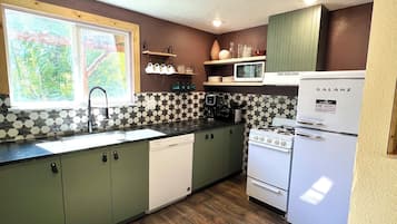 Microwave, stovetop, coffee/tea maker, cookware/dishes/utensils