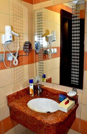 Hair dryer, towels, soap, shampoo