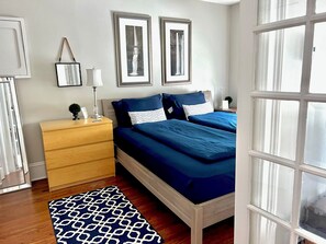 1 bedroom, desk, iron/ironing board, travel crib