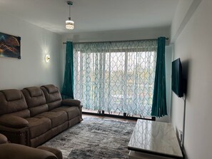 Smart TV - A vibrant and connected hub blending urban living, green spaces, and convenience (Nairobi)