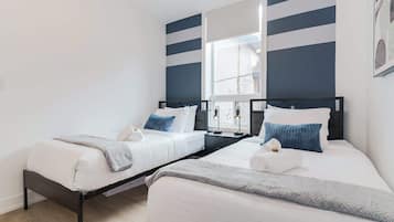 Suite, 3 Bedrooms, Patio, City View | 3 bedrooms, desk, laptop workspace, iron/ironing board