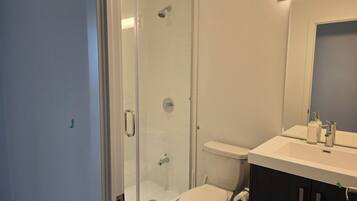 Shower, towels, soap, toilet paper