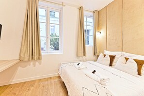 Apartment | Laptop workspace, iron/ironing board, bed sheets