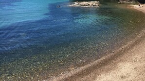 A coastal landscape with clear blue waters, rocky shore, and a forested hill. - [2] Blue Summer Vibes Mini Studio, A/C, parking, 50m from beach, SPA access (La Ciotat)