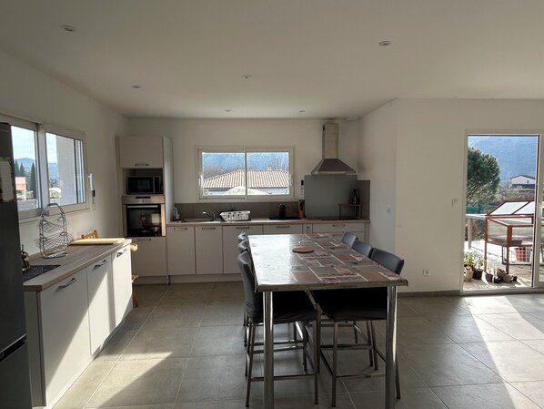 Enjoy meals in this well-equipped kitchen with a central island and dining area.