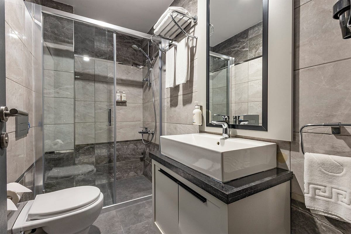 Shower, free toiletries, hair dryer, slippers