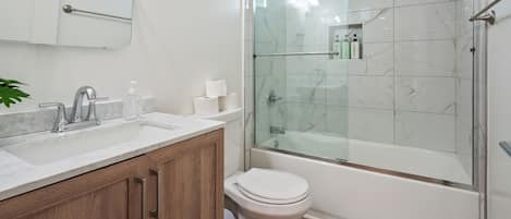 Shower, hair dryer, towels, soap