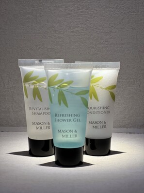 Shower, hair dryer, towels, soap