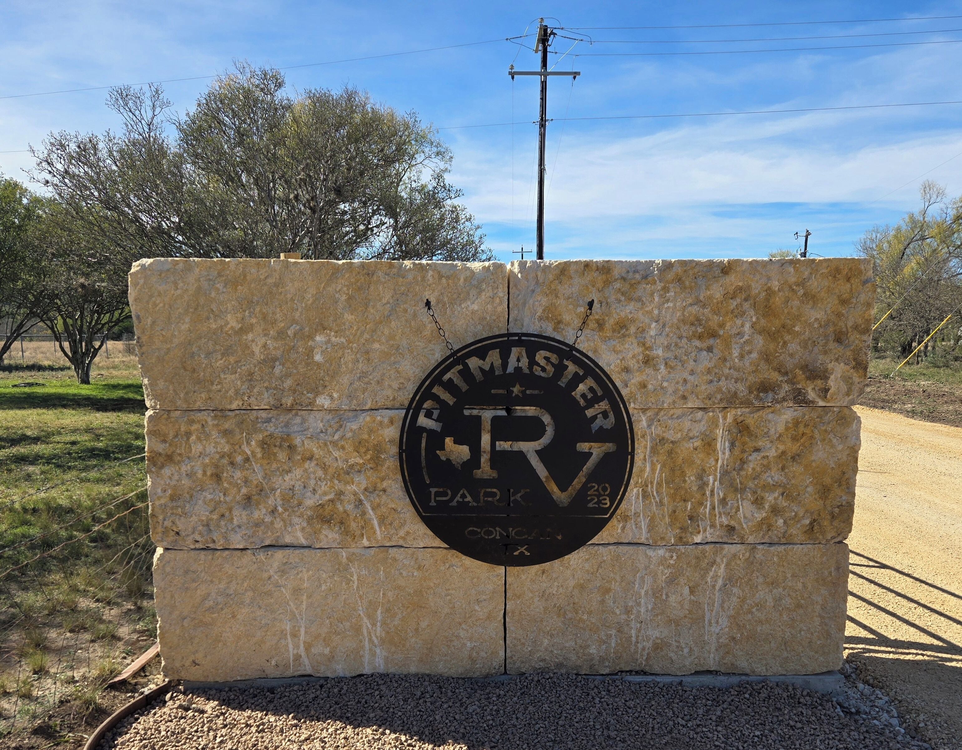 A stone sign with the text "Fittmaster Park RV" and the year "2023".