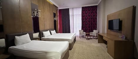 Comfort Triple Room, City View | In-room safe, individually decorated, individually furnished, desk