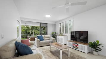 Apartment, 3 Bedrooms, Pool View | Living room | 50-inch Smart TV with cable channels, offices