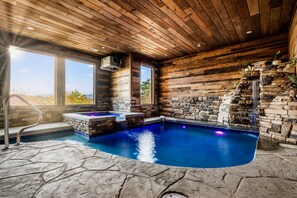 Indoor pool, a heated pool - Crown Point Lodge ~ Luxury 6BR ~ Indoor Pool ~ Game Room (Sevierville)