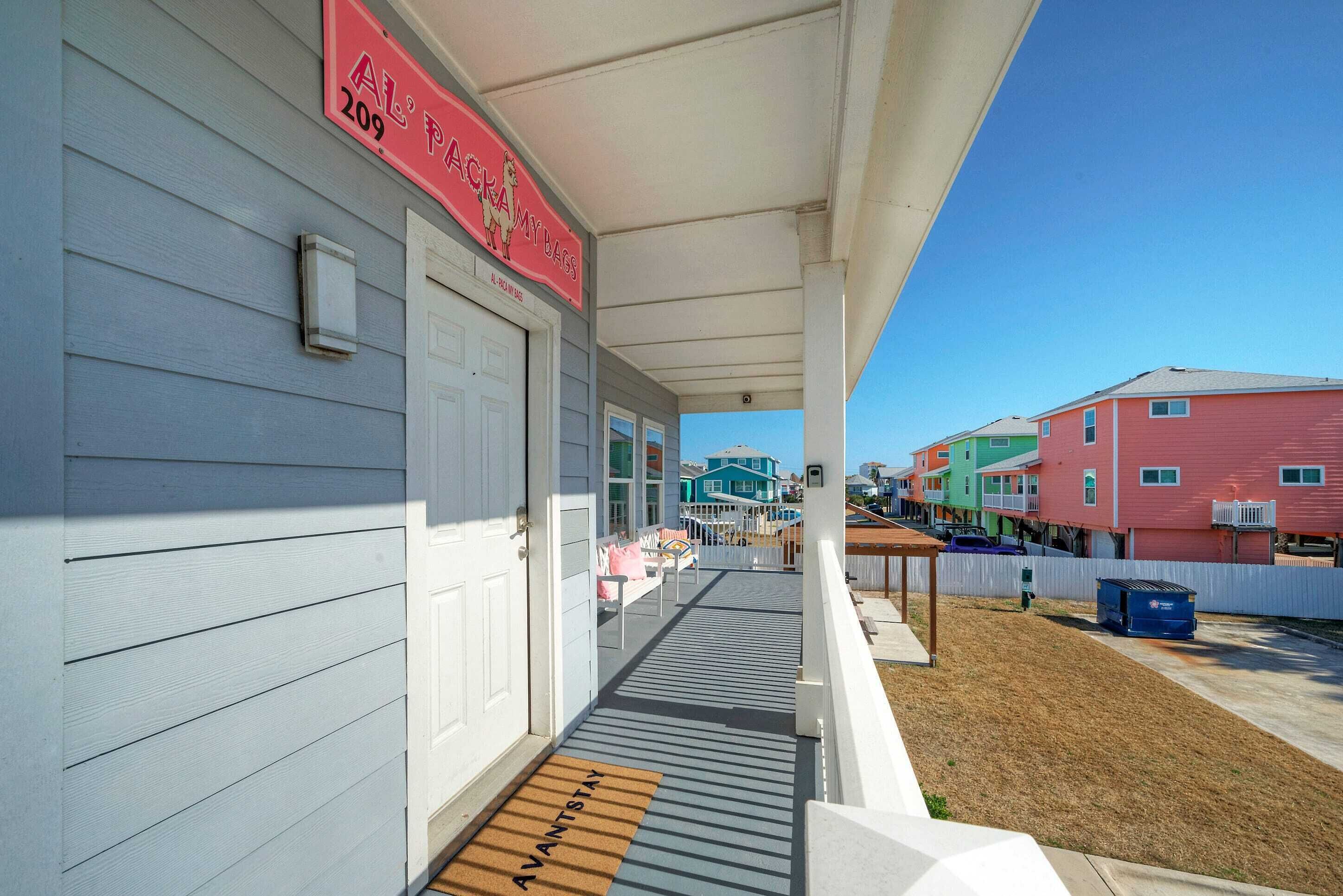 A house with a porch, a mailbox, and a street view.