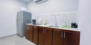Fridge, microwave, stovetop, coffee/tea maker