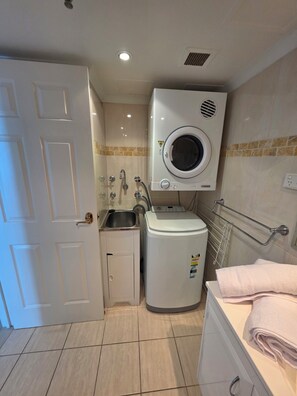 Shower, hair dryer, towels, toilet paper