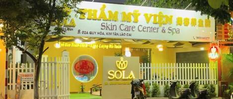 A building with a sign for a skin care center and spa.
