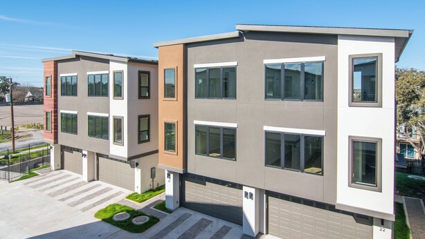 A modern multi-story residential building with a flat roof, large windows, and a garage. - Luxury Home in North Austin: Next to Apple Campus (Austin)