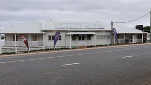 A hotel with a sign reading 'VICTORY HOTEL' and a 'BISTRO ENTRY' sign. - Victory Hotel Motel Gympie  (Gympie)