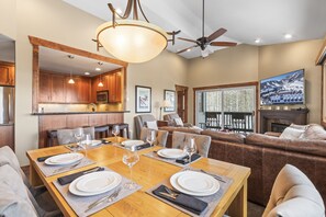 Enjoy a warm and inviting space with a dining area, cozy seating, and a fireplace.