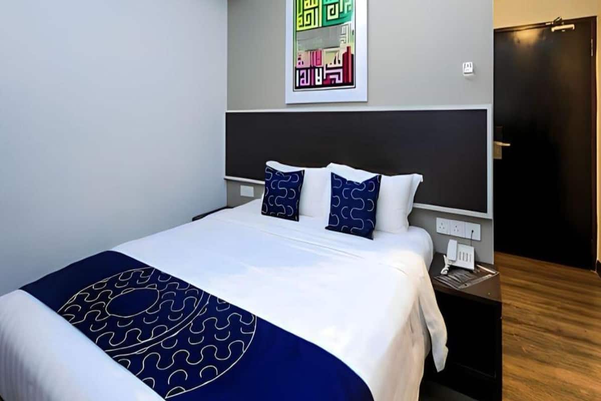 Premium bedding, desk, laptop workspace, free WiFi