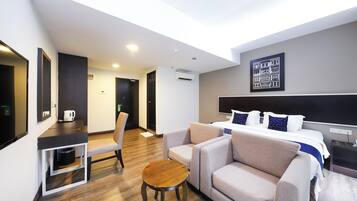 Premium bedding, desk, laptop workspace, free WiFi