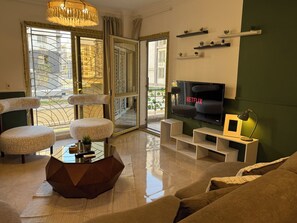 TV - Unique 3-Bedroom Apartment in First Al Sheikh Zayed, Cairo (First Al Sheikh Zayed)