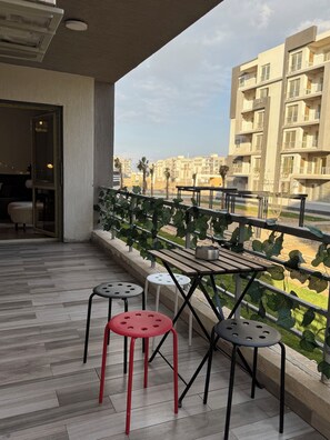 Outdoor dining - Unique 3-Bedroom Apartment in First Al Sheikh Zayed, Cairo (First Al Sheikh Zayed)
