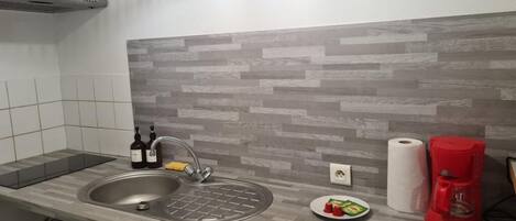 Fridge, microwave, stovetop, coffee/tea maker