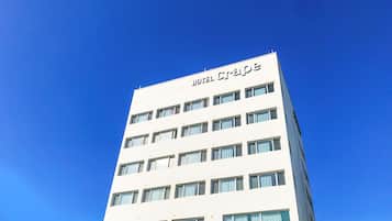 Hotel Crepe offers a sleek, multi-story building with a flat facade and evenly spaced windows.