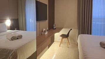 Premium bedding, desk, laptop workspace, free WiFi