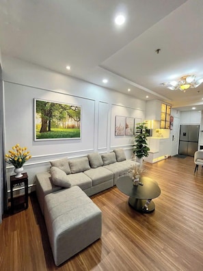 Business Apartment | Living area | 45-inch TV with digital channels, DVD player - SOL- Vinhomes Times City & Park Hill (Hanoi)