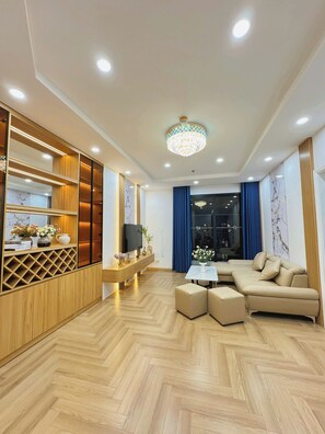 Business Apartment | Living area | 45-inch TV with digital channels, DVD player - SOL- Vinhomes Times City & Park Hill (Hanoi)