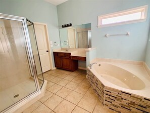 Shower, jetted bath, towels, soap