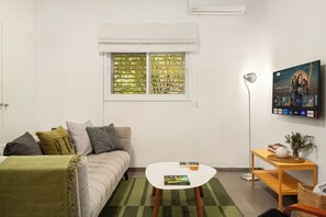 Apartment, Garden View | Living area | TV