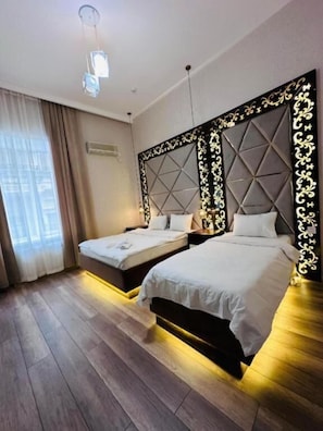 Quarto triplo standard, vista para a cidade | Vista do quarto