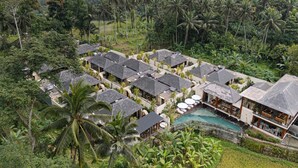 A resort with multiple bungalow-style buildings, a swimming pool, and lush tropical surroundings. - Asvara Resort & Spa Ubud by Ini Vie Hospitality (Ubud)