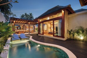 A modern resort with a swimming pool, lounge chairs, and a well-lit outdoor area. - Asvara Resort & Spa Ubud by Ini Vie Hospitality (Ubud)