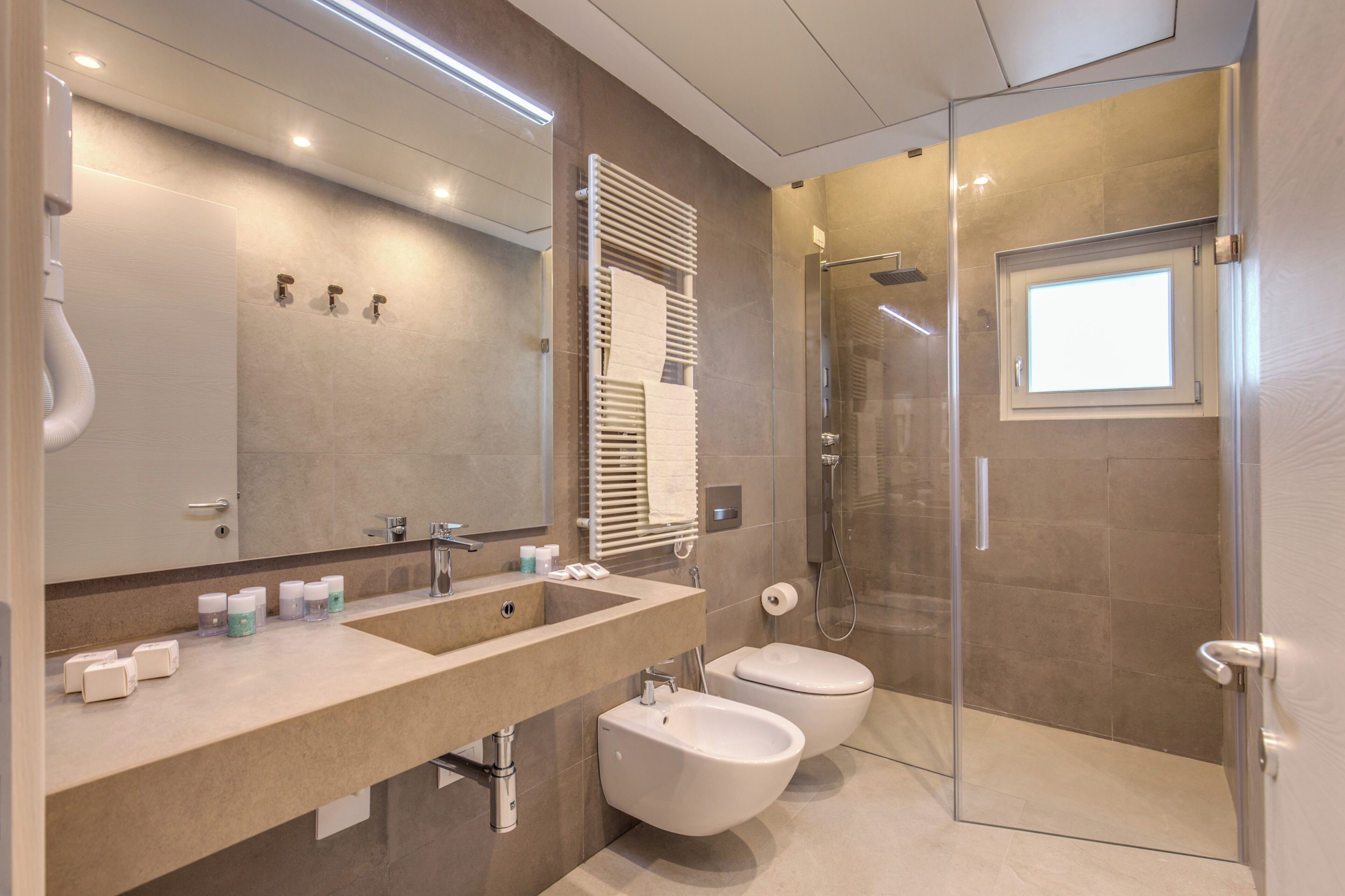 Luxury Apartment, Balcony | Bathroom | Shower, hair dryer, slippers, towels