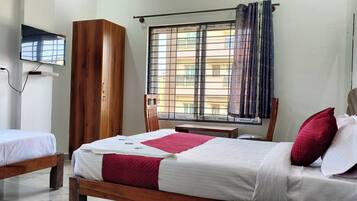 Hypo-allergenic bedding, down duvets, desk, laptop workspace