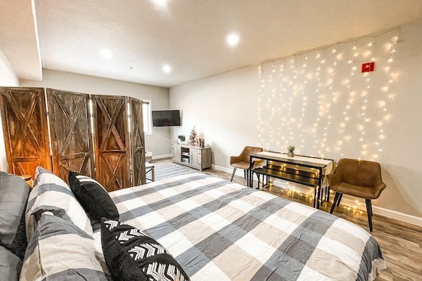 The suite has a comfortable bed with high quality linens