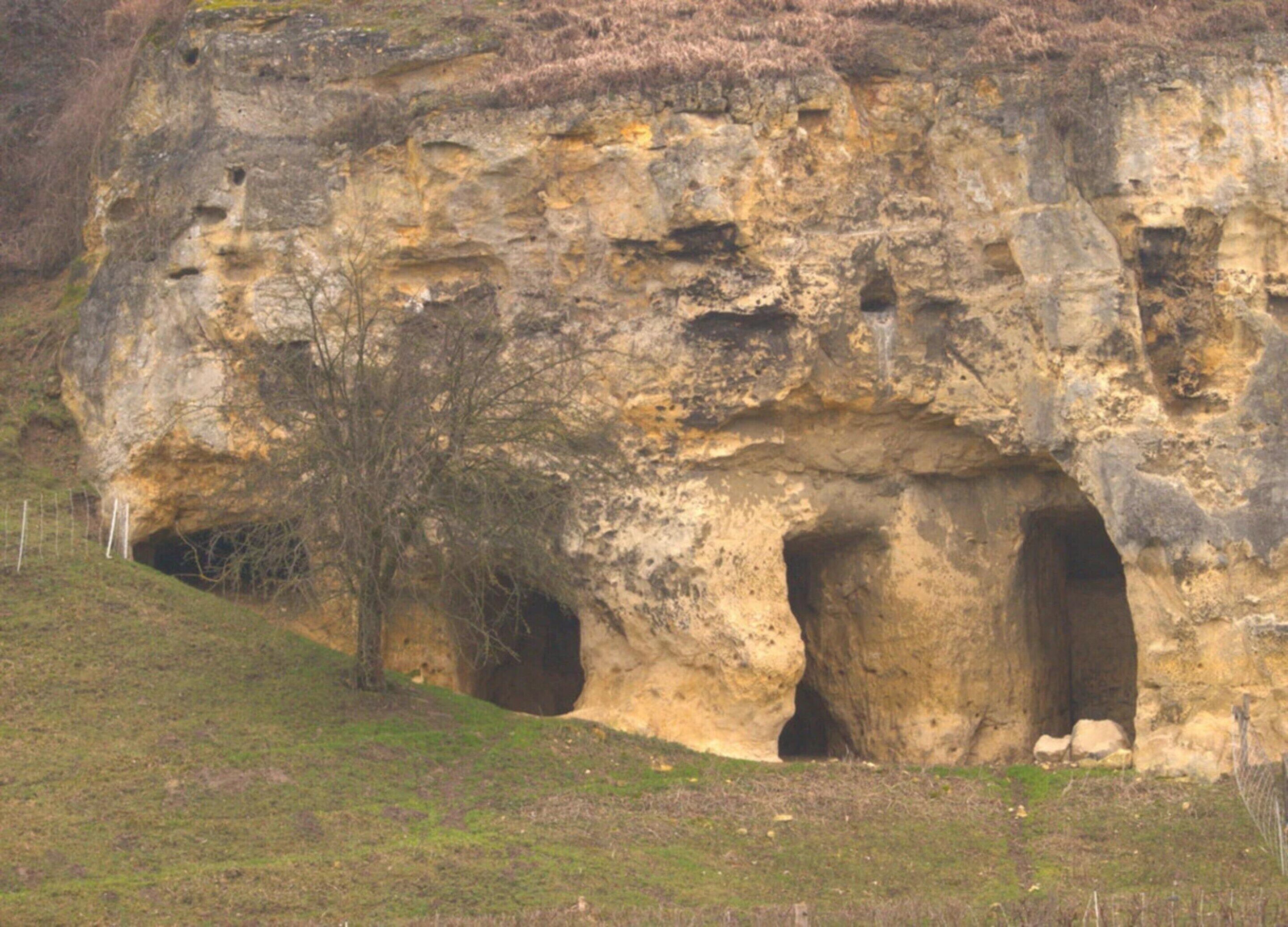A natural rock formation with two caves.